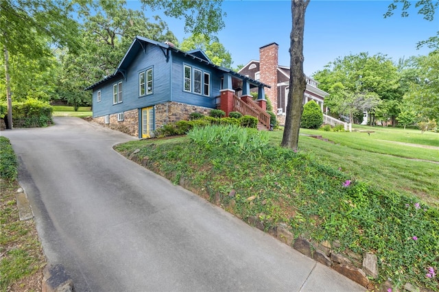 view of home's exterior with a lawn