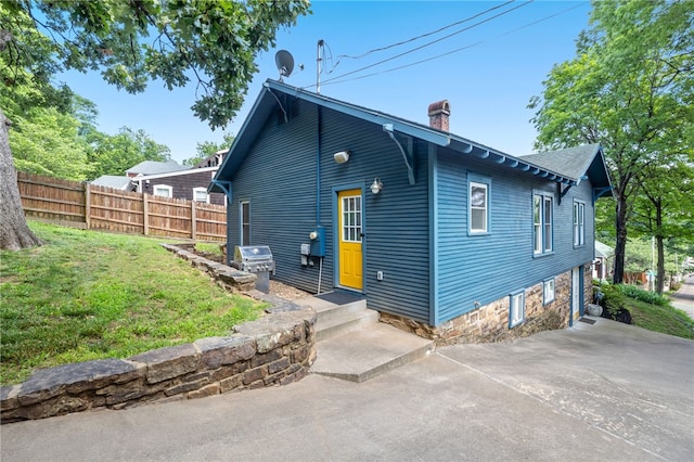 rear view of property with a patio area and a yard