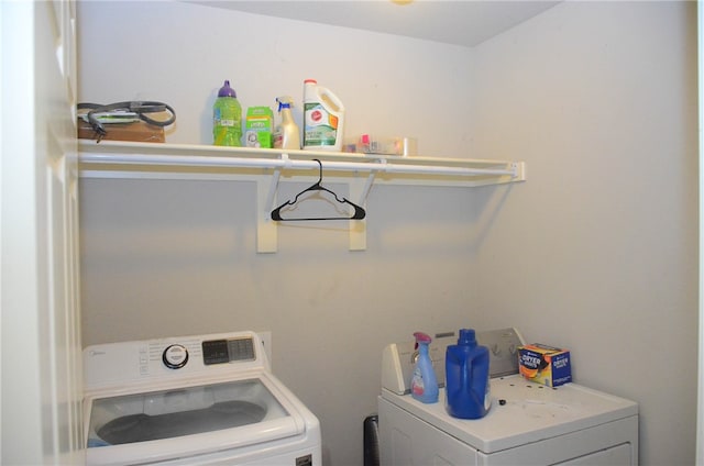 washroom featuring independent washer and dryer