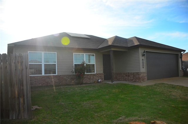 view of front of home with a garage and a front yard