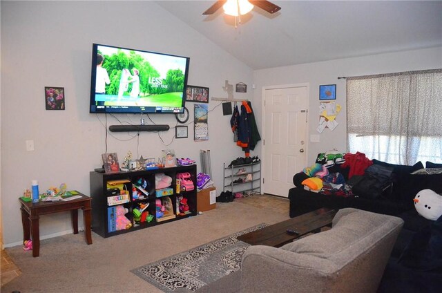 carpeted living room featuring ceiling fan and vaulted ceiling