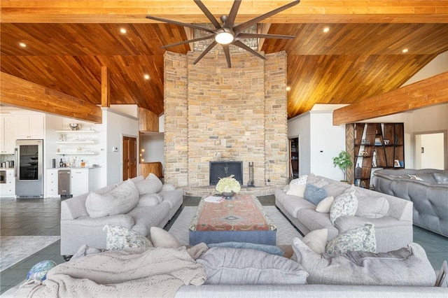 living room with ceiling fan, a fireplace, beamed ceiling, wood ceiling, and high vaulted ceiling