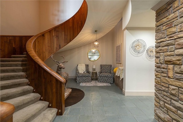 stairway with wood walls