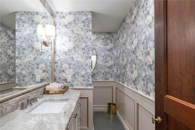 bathroom with tile patterned floors and vanity