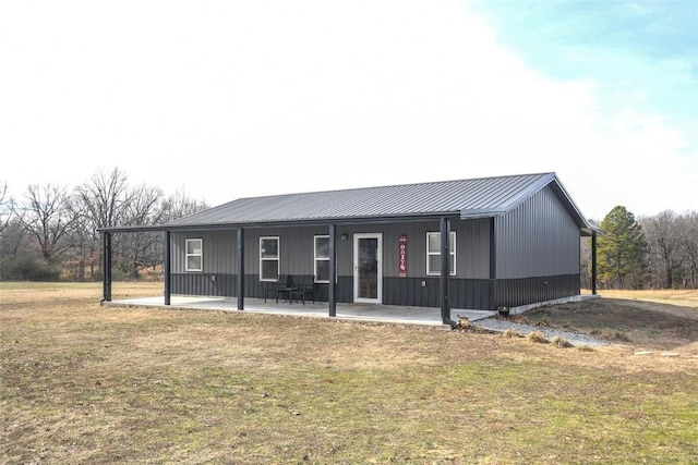 view of front facade with a patio area and a front lawn