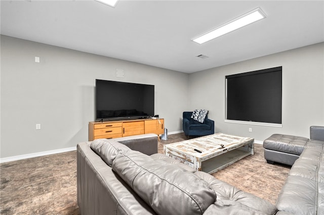 carpeted living area with baseboards