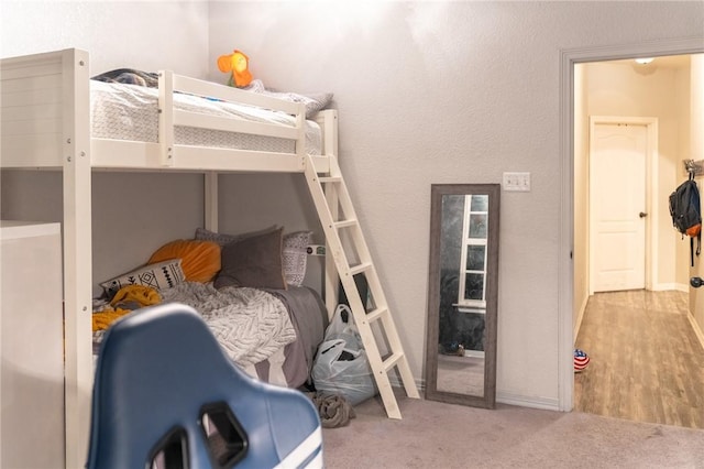 bedroom featuring light carpet