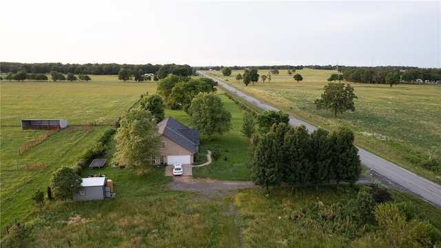 birds eye view of property with a rural view