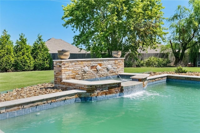 view of pool featuring a yard and pool water feature