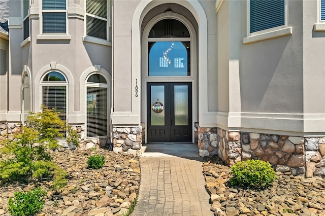 entrance to property featuring french doors