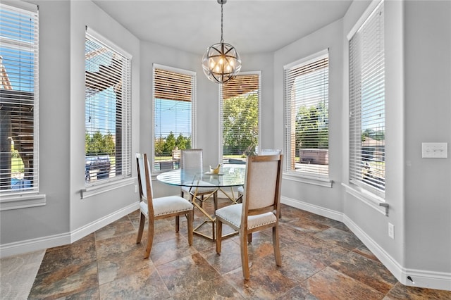 dining space featuring an inviting chandelier and a wealth of natural light