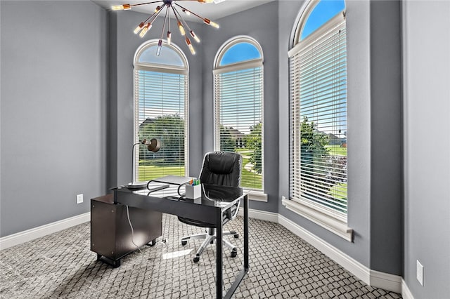 office with a chandelier and a healthy amount of sunlight