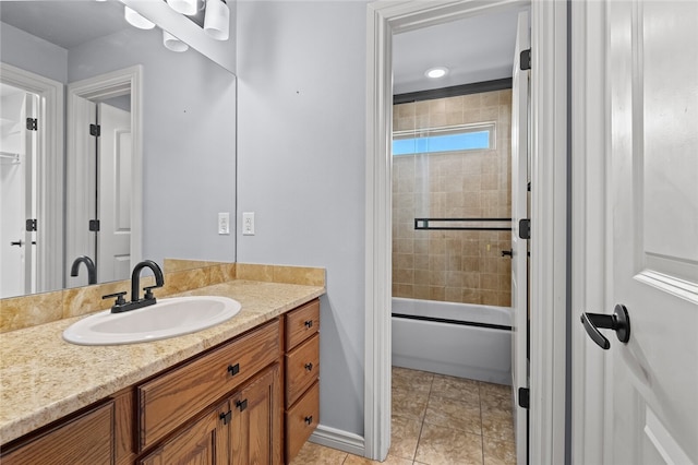 bathroom with tile patterned flooring, vanity, and enclosed tub / shower combo