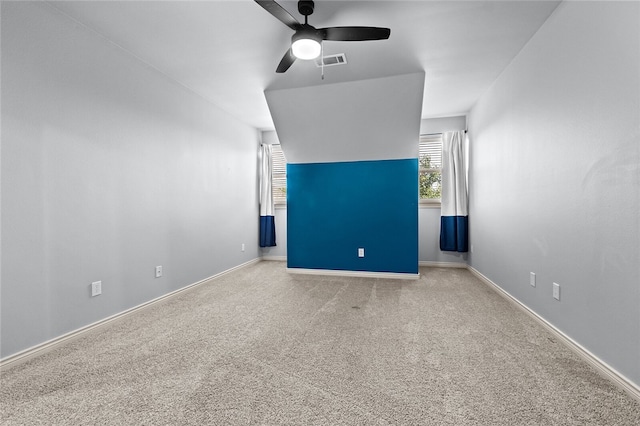 interior space with ceiling fan and carpet floors