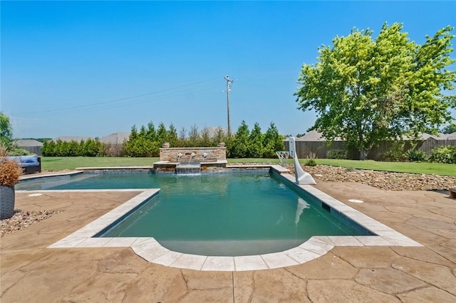 view of pool with a yard and pool water feature