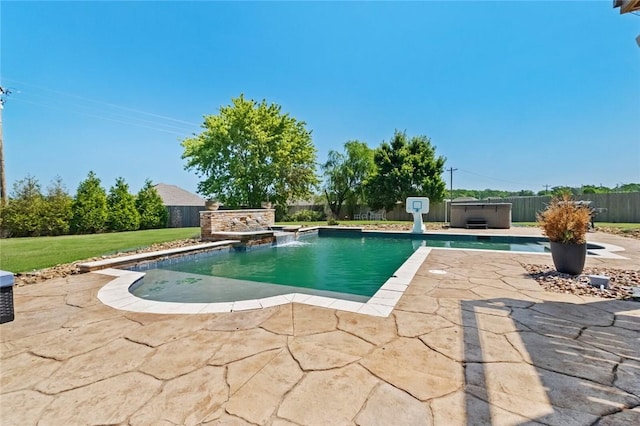 view of pool featuring a jacuzzi, pool water feature, and a patio area