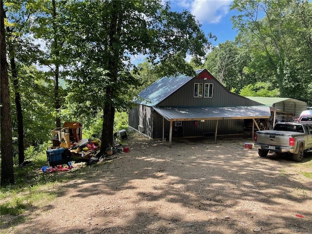 view of side of property featuring a carport