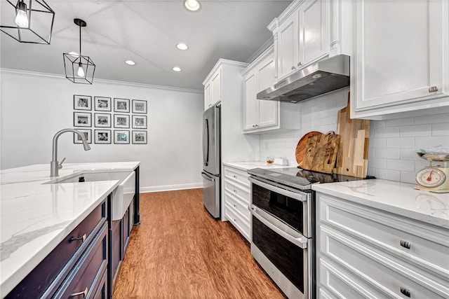 15225 Asher Ct, Siloam Springs, AR 72761 - kitchen with stainless steel appliances, under cabinet range hood, white cabinets, crown molding, and recessed lighting