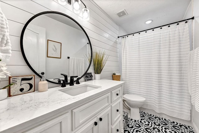 bathroom featuring a shower with curtain, visible vents, toilet, and vanity
