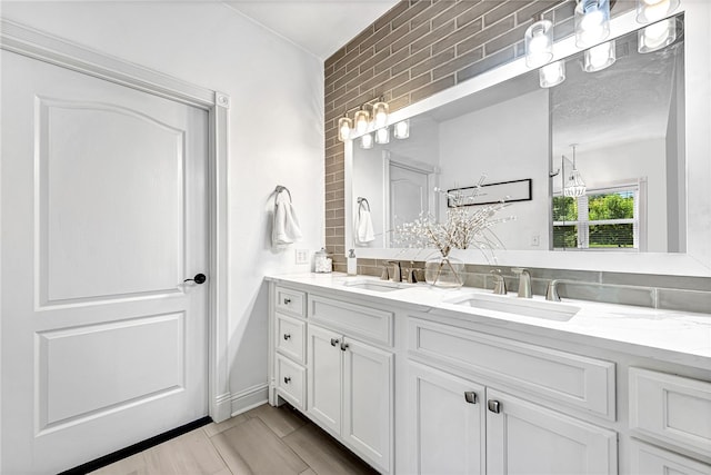 bathroom featuring vanity and tasteful backsplash