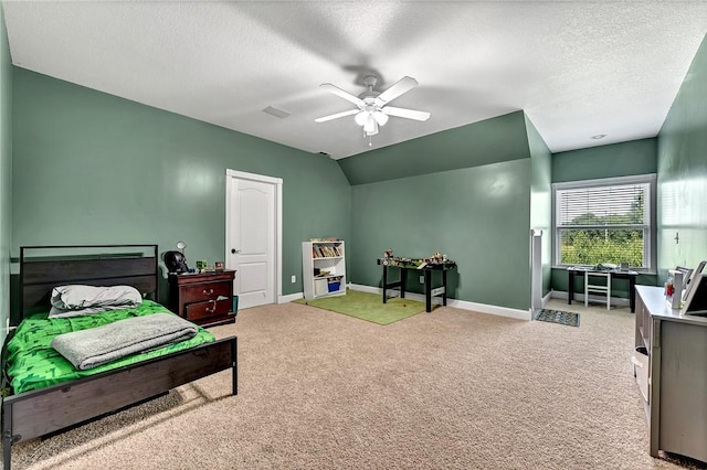 bedroom with baseboards, a textured ceiling, vaulted ceiling, and light carpet