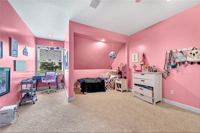 carpeted bedroom featuring a textured ceiling and lofted ceiling