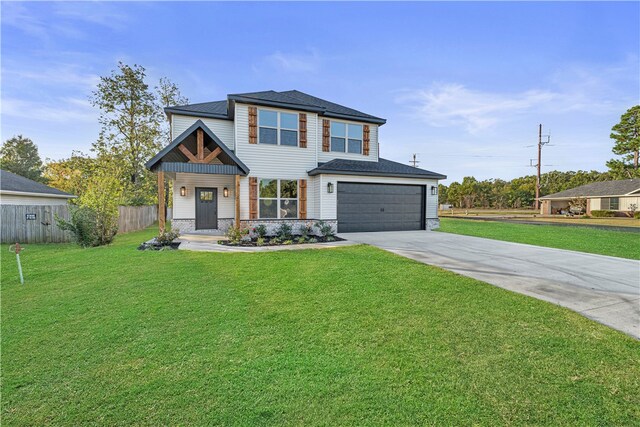 view of front of property featuring a front lawn and a garage