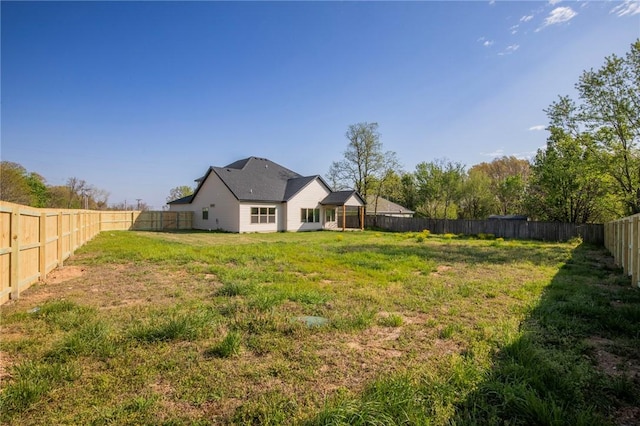 view of yard with a fenced backyard