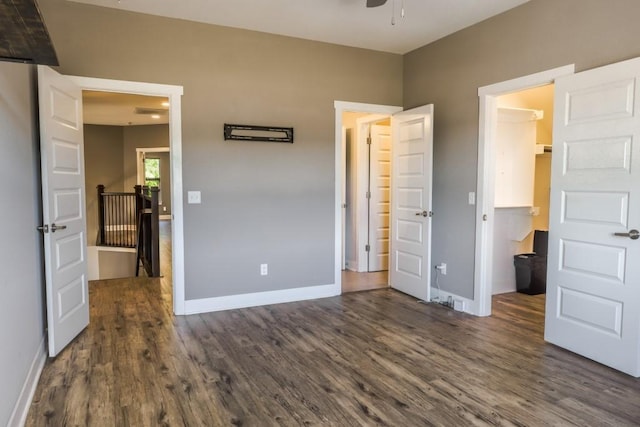 unfurnished bedroom featuring dark hardwood / wood-style floors