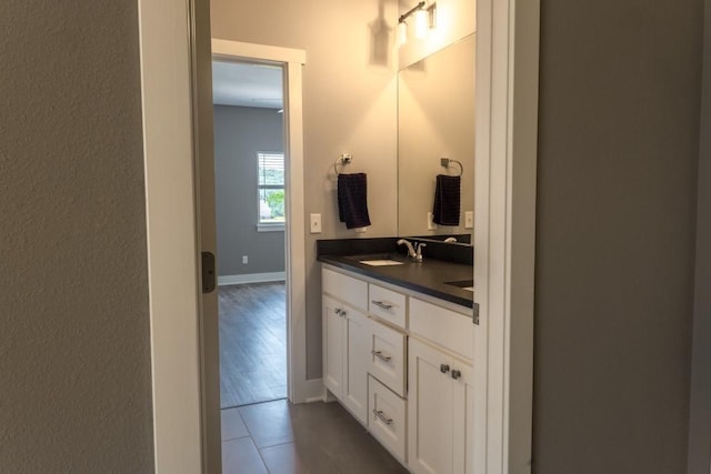 bathroom with tile patterned floors and vanity