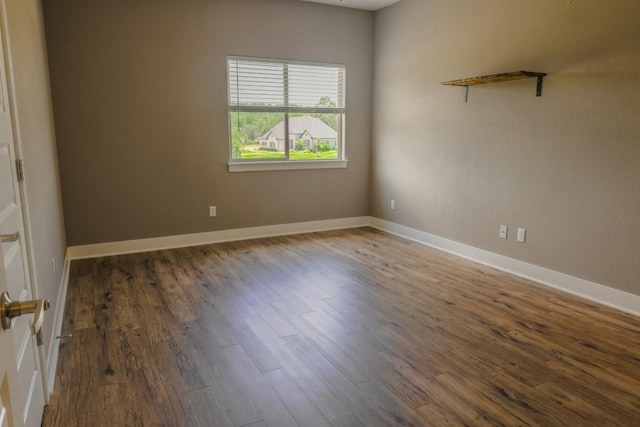 empty room featuring dark wood-type flooring