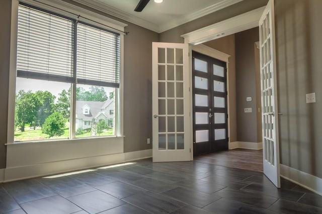 entryway featuring ceiling fan, a healthy amount of sunlight, ornamental molding, and french doors