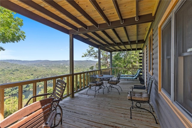 wooden terrace with a mountain view