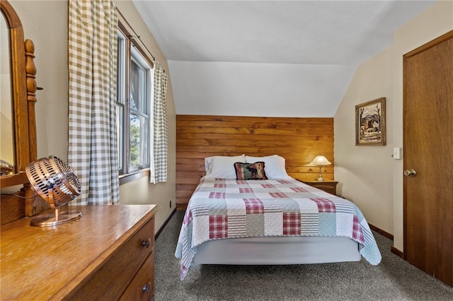 bedroom featuring carpet floors and vaulted ceiling