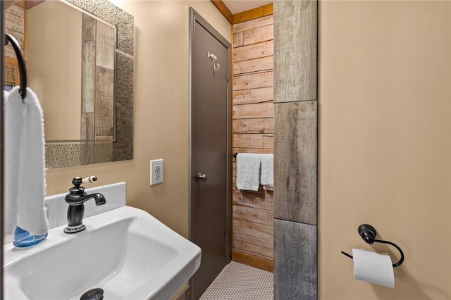 bathroom with tile flooring and sink