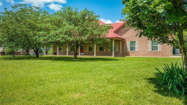 rear view of house with a lawn