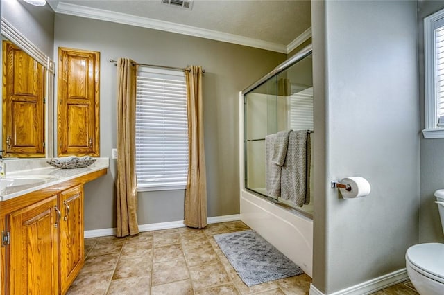 full bathroom with combined bath / shower with glass door, tile patterned floors, vanity, crown molding, and toilet