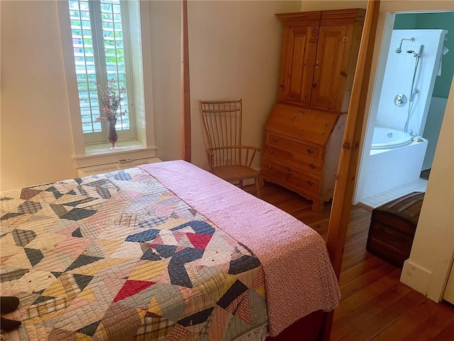 bedroom with dark hardwood / wood-style flooring