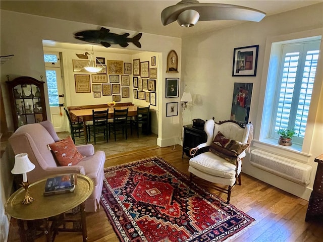 interior space with a healthy amount of sunlight, hardwood / wood-style flooring, and ceiling fan