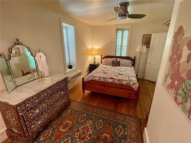 bedroom featuring ceiling fan and hardwood / wood-style floors