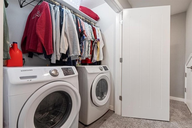 laundry area with light carpet and independent washer and dryer