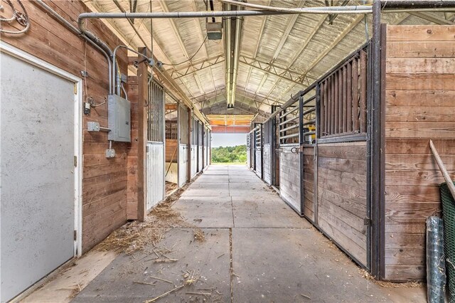 view of horse barn with electric panel