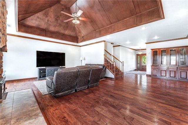 living room with ceiling fan, dark hardwood / wood-style flooring, wooden ceiling, and vaulted ceiling