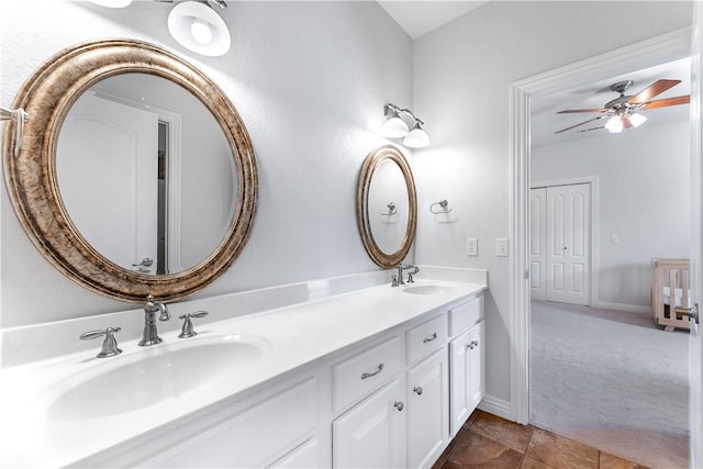 bathroom with ceiling fan and vanity