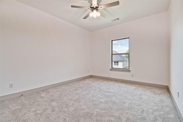 unfurnished room with ceiling fan and light colored carpet