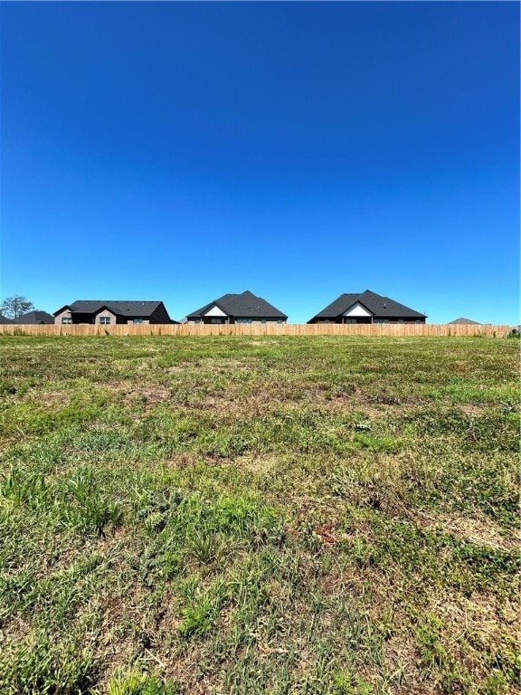 view of yard with a rural view