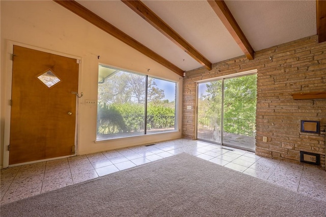 unfurnished sunroom with lofted ceiling with beams