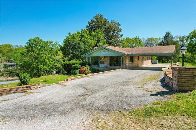 single story home with a carport