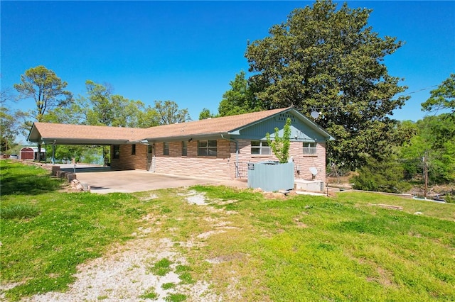 rear view of property featuring a lawn