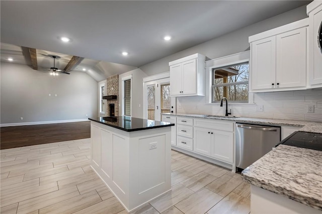 32 Taransay Dr, Bella Vista, AR 72715 - kitchen featuring backsplash, a sink, a ceiling fan, a fireplace, and stainless steel dishwasher
